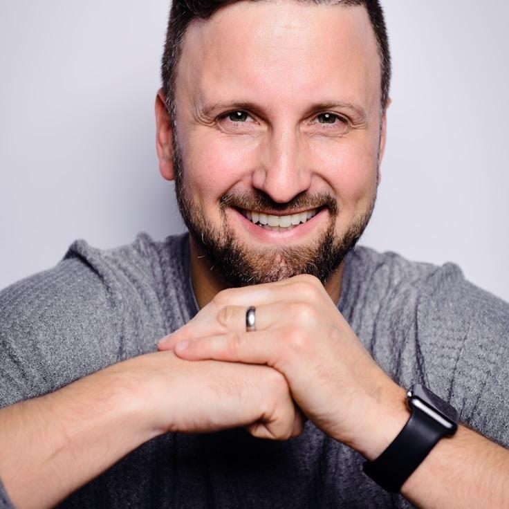 Amina Shah, Lead Design Curator at MeadowRidgeWay, reviewing corporate floral arrangements